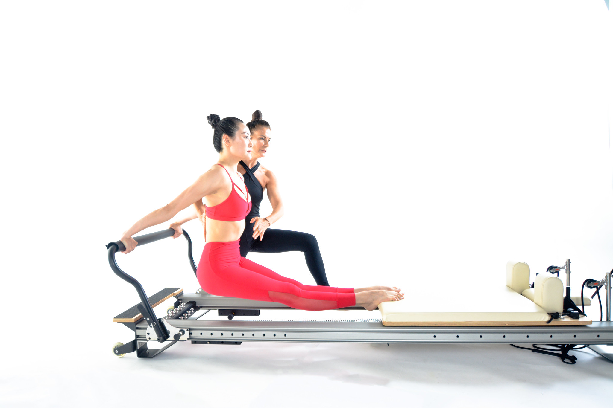 Pilates Instructor teaching a group